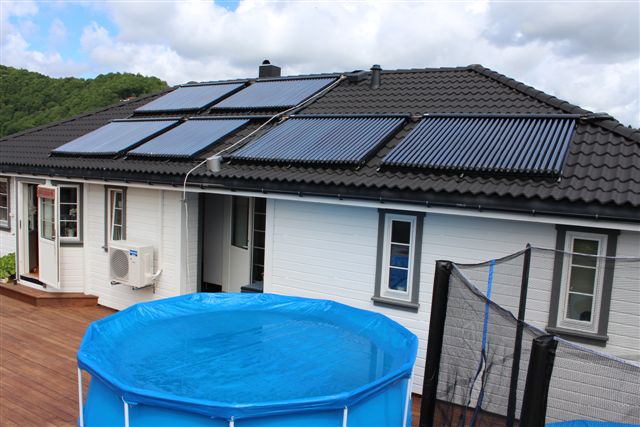 How can the solar heating system heat the swimming pool