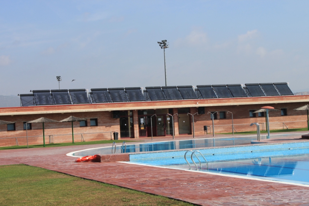 How can the solar heating system heat the swimming pool